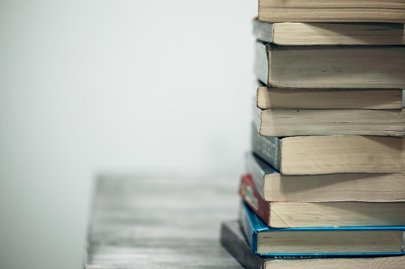 Stack of Books Photo by Sharon McCutcheon on Unsplash